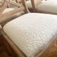 Set of 6 cross-back chairs in solid wood, with white boucle seats.