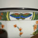 Shallow porcelain dish from Limoges Raynaud, bird decoration.