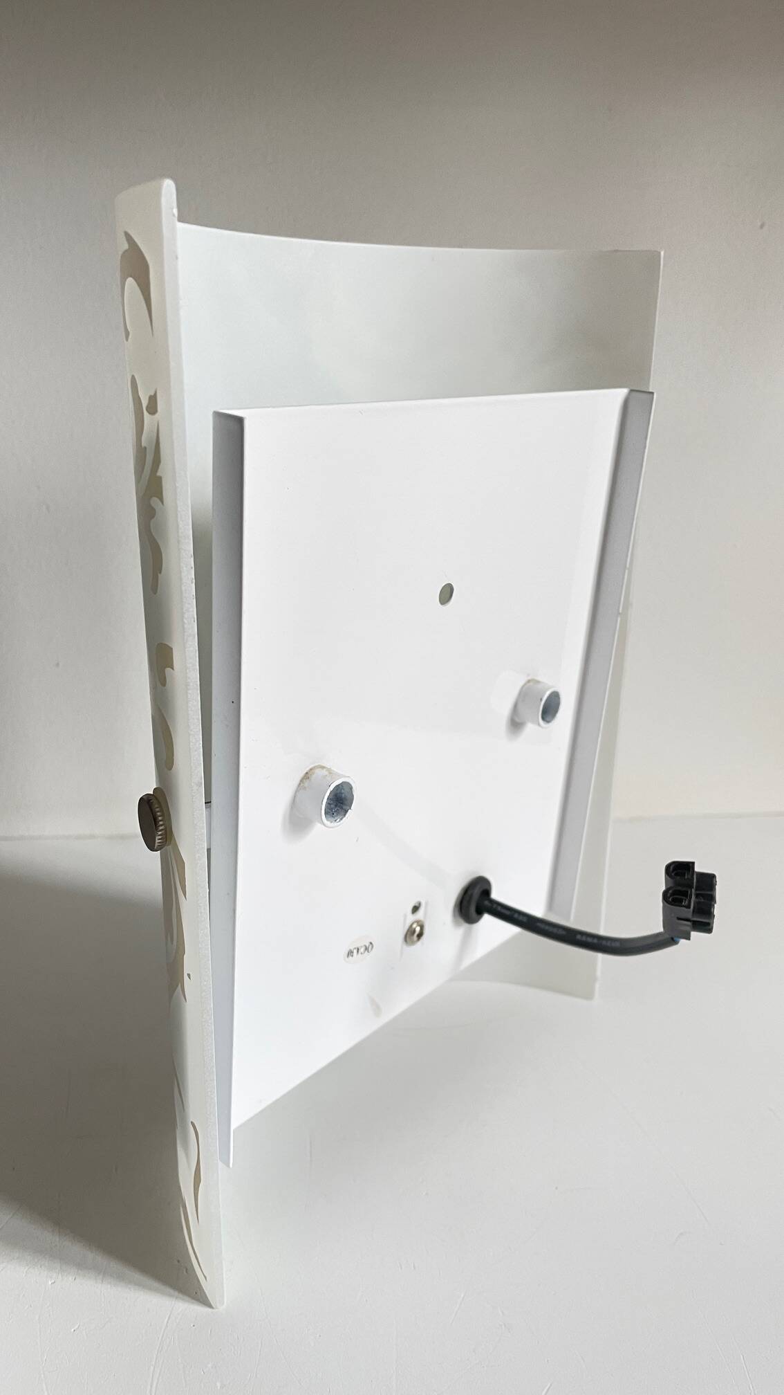 Polished and screen-printed glass sconce by eglo