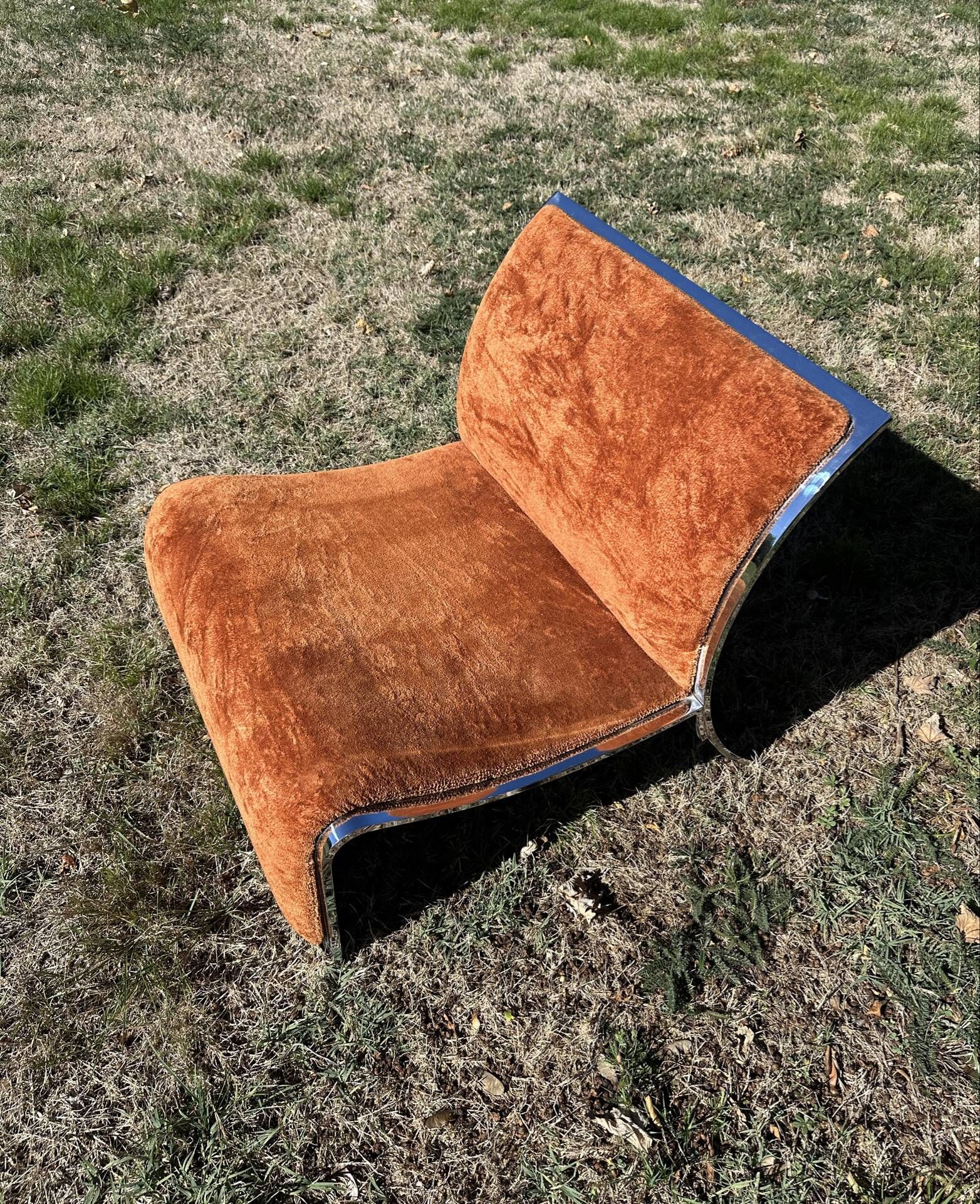 Chrome steel armchair and orange fabric by Vittorio Introini