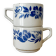 Set of 2 antique earthenware cups with blue floral pattern.