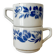 Set of 2 antique earthenware cups with blue floral pattern.