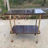 Brown rosewood rolling table with gold legs