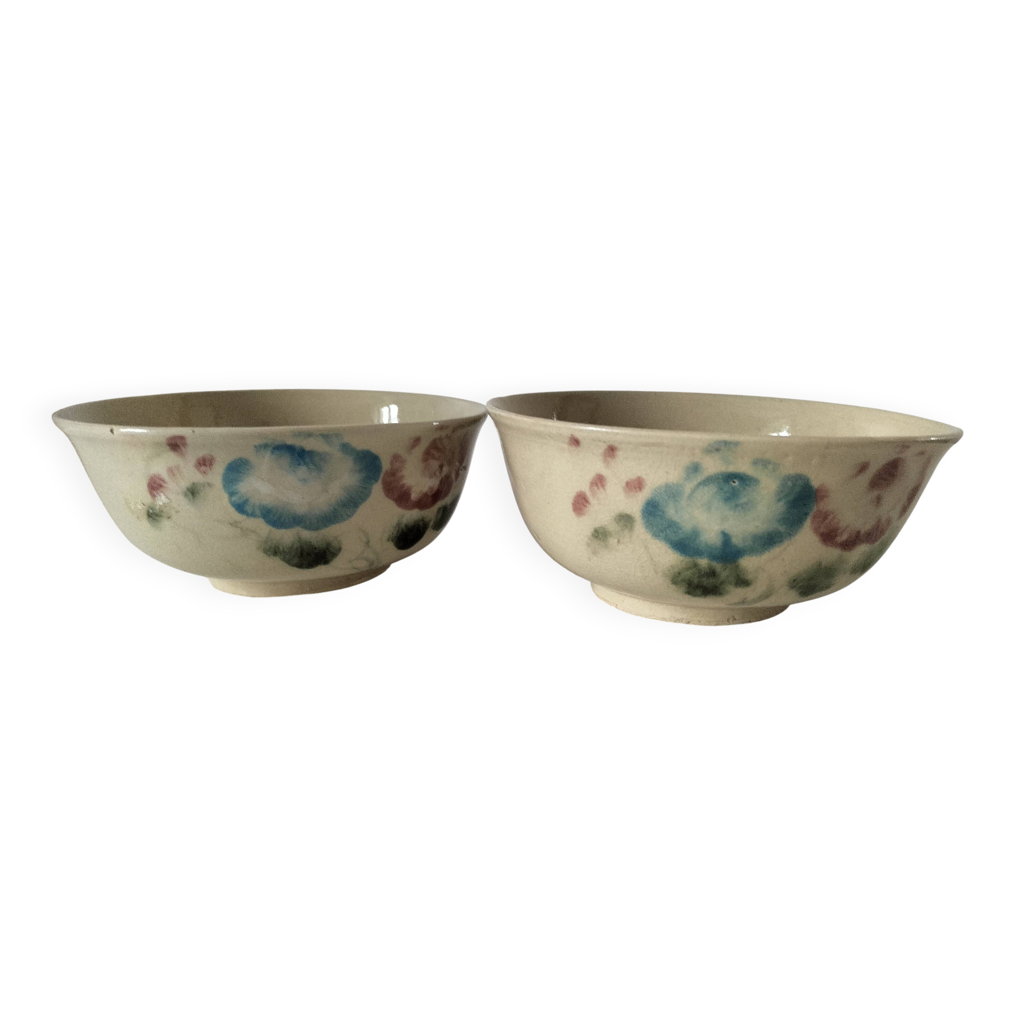 Two large vintage bowls in pastel decor on mini pedestals.