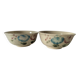Two large vintage bowls in pastel decor on mini pedestals.