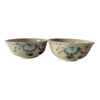 Two large vintage bowls in pastel decor on mini pedestals.