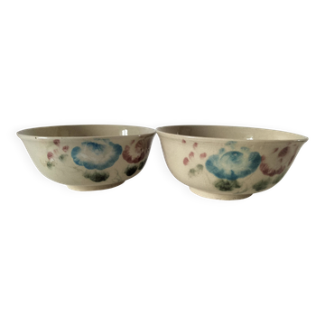 Two large vintage bowls in pastel decor on mini pedestals.
