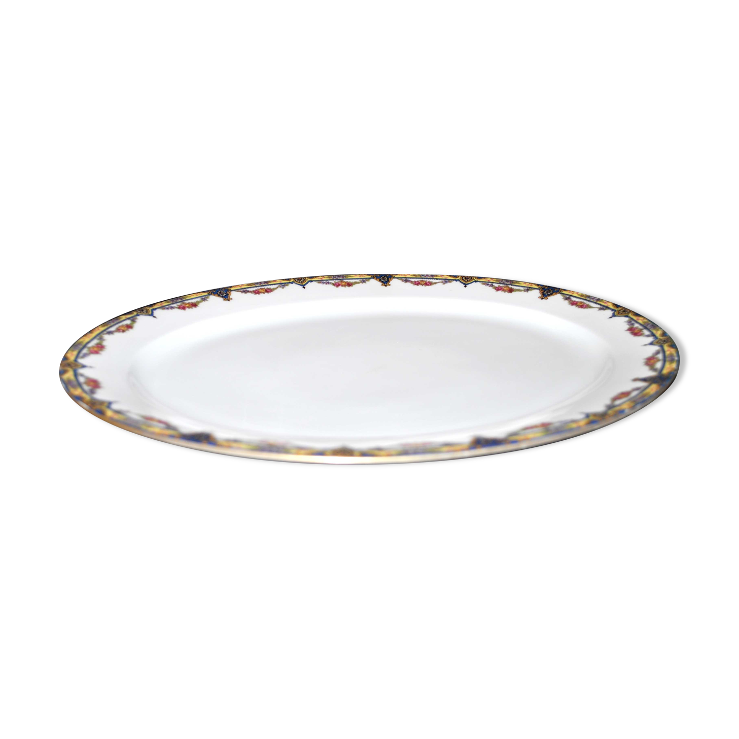 Oval dish in Limoges porcelain W.GUERIN &Cie decorated with floral garlands