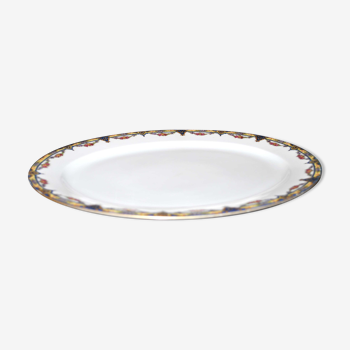 Plat ovale en porcelaine de limoges w.guerin & cie à décor de guirlandes fleuries