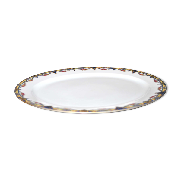 Plat ovale en porcelaine de limoges w.guerin & cie à décor de guirlandes fleuries
