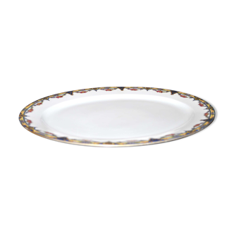 Oval dish in Limoges porcelain W.GUERIN &Cie decorated with floral garlands