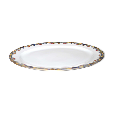 Oval dish in Limoges porcelain W.GUERIN &Cie decorated with floral garlands