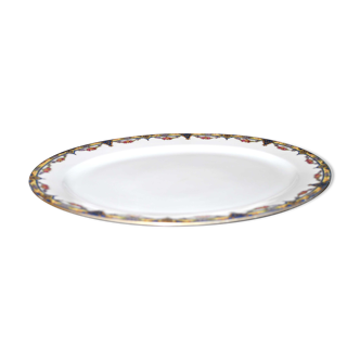 Plat ovale en porcelaine de limoges w.guerin & cie à décor de guirlandes fleuries