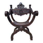 Curule chair Dagobert "Great Discoveries" in carved walnut (19th century)
