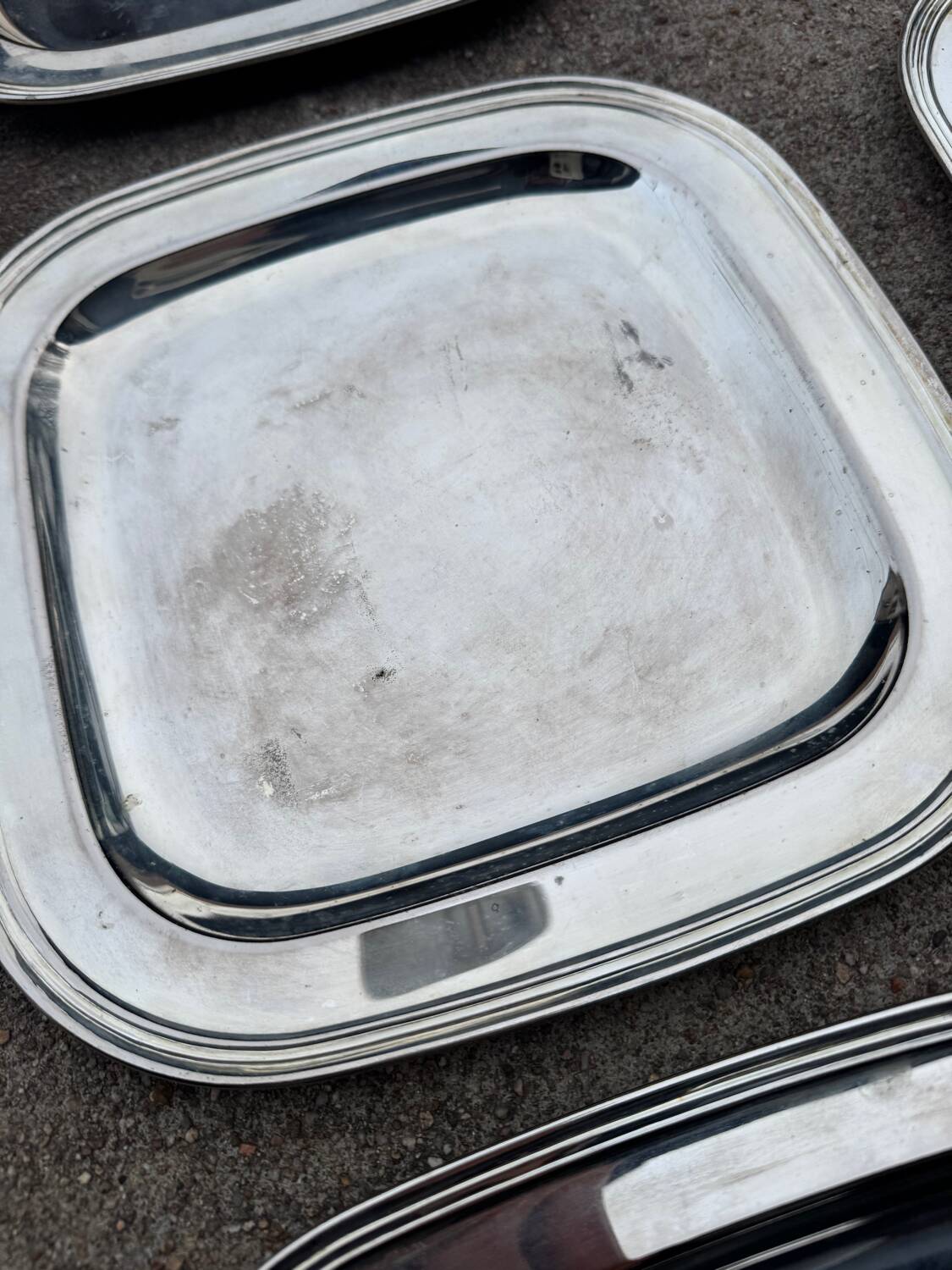 Silver-plated metal underplates from the 1980s.