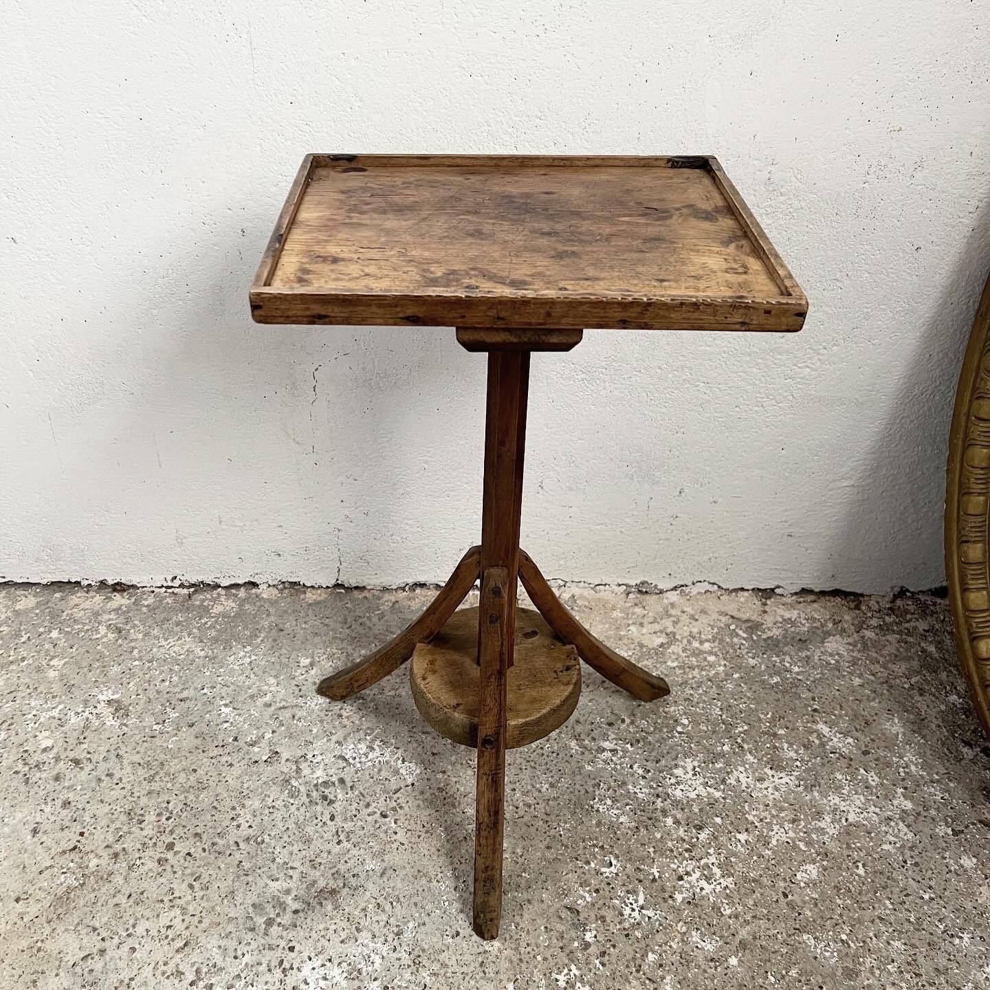 Old primitive wooden tripod pedestal table