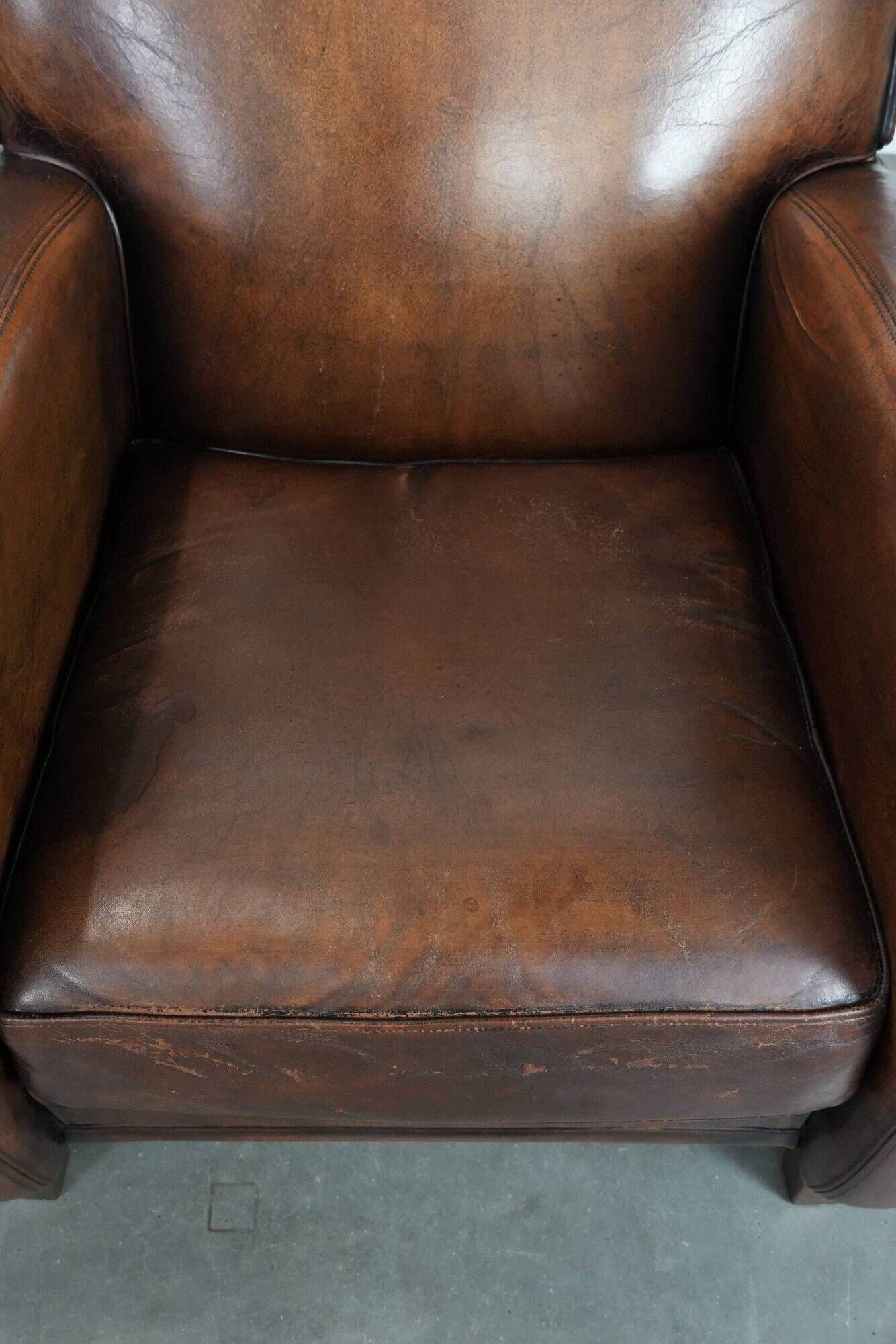 Characterful set of two vintage sheepskin armchairs with beautiful colours
