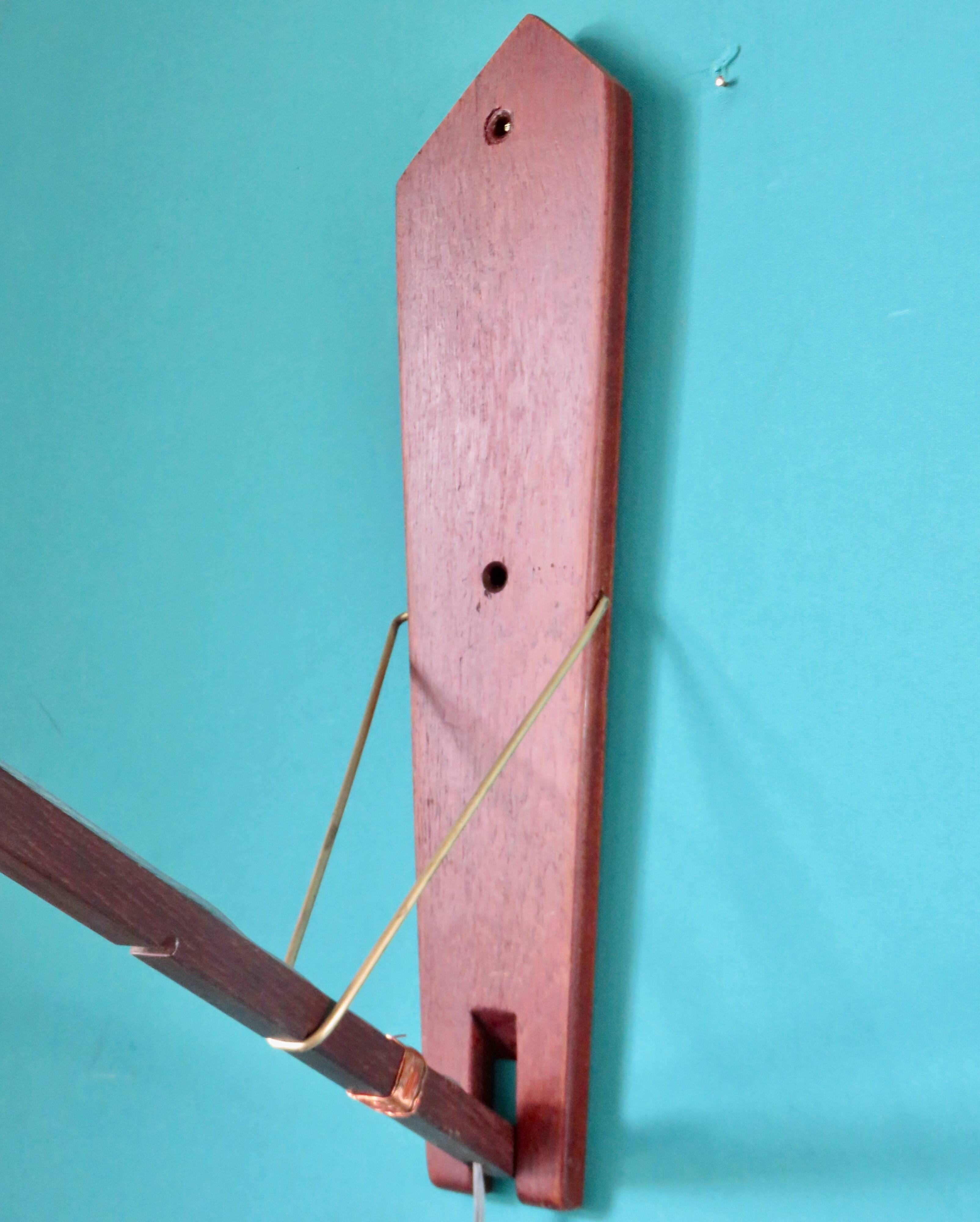 Teak wall light with articulated arm. Denmark 1960