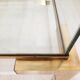 Coffee table with sliding shelf in lucite, brass and glass, Hollywood Regency