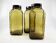 3 molded amber glass pharmacy bottles • Bakelite stoppers • 1950
