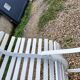 Old garden bench with metal legs and wooden slats