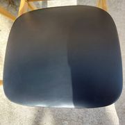 3 Scandinavian style chairs, light wood and black faux leather.