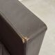 Vintage brown leather club armchair with a swivel side table.