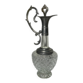 Vintage glass decanter with cut design and silver-plated metal, stopper included.