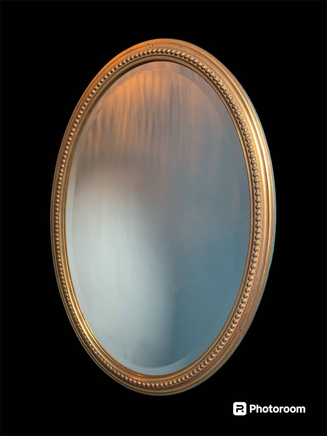 Vintage beveled gold oval mirror