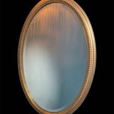 Vintage beveled gold oval mirror