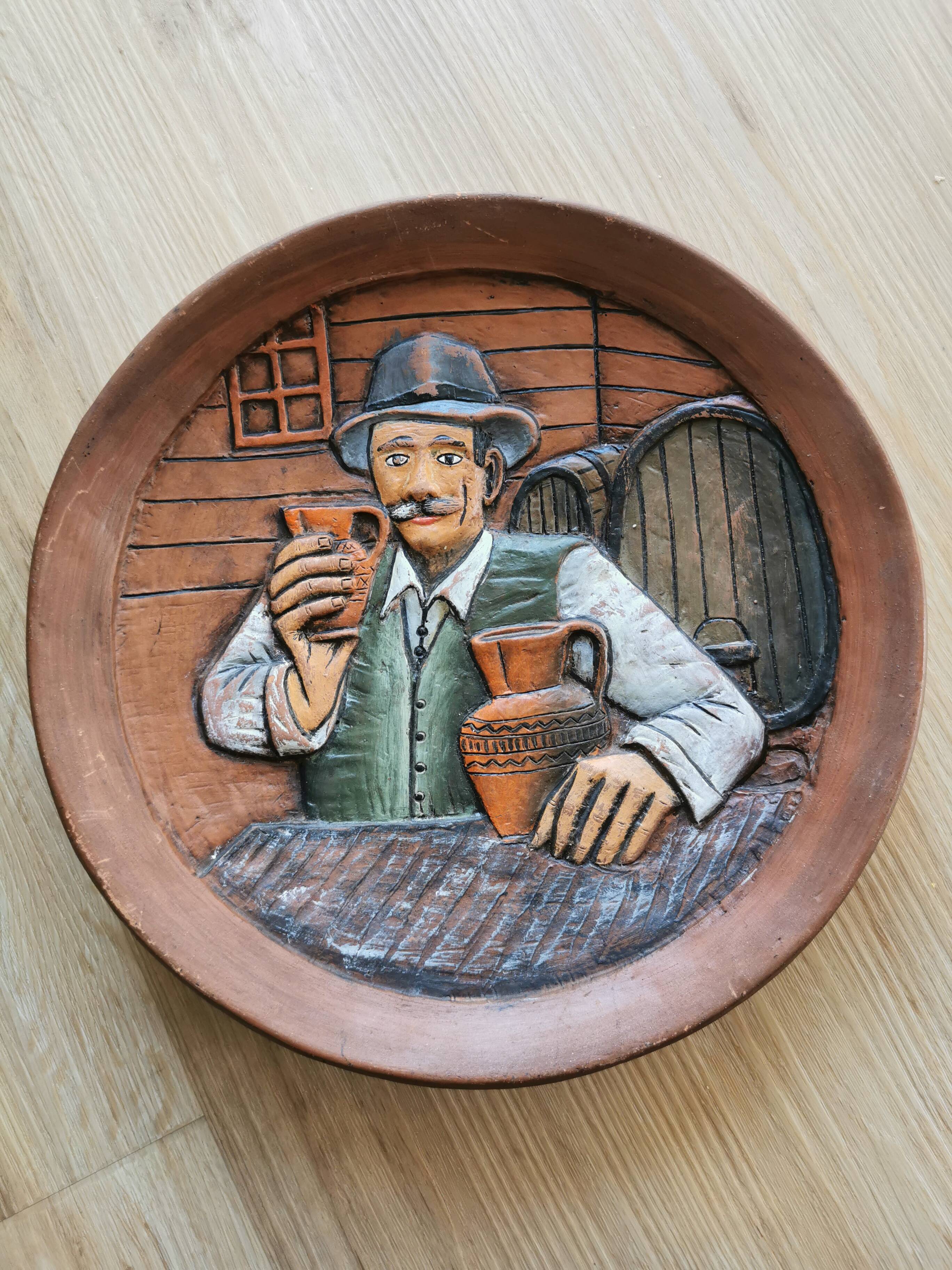 Vintage Embossed Clay Plate: Man Drinking, Retro Wall Decor