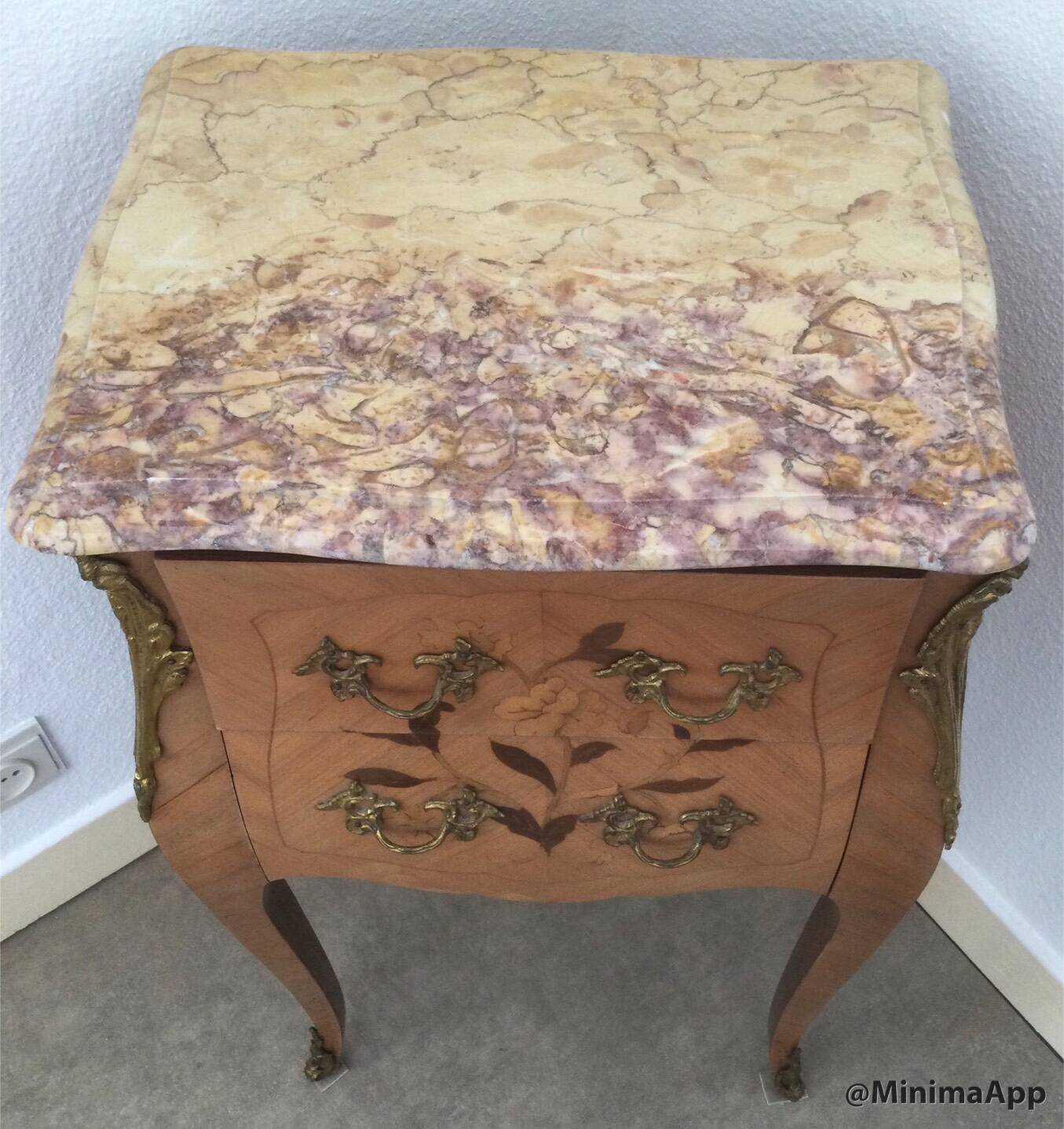 Pair of curved bedside tables in the Louis XV style with noble wood marquetry from the period.