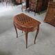 Half-moon gaming table in Louis XV style, made of precious wood marquetry.