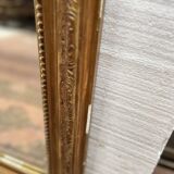 Miroir de style Louis XV en bois et stuc doré XX siècle