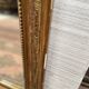 Louis XV style mirror in gilded wood and stucco, 20th century.