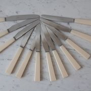 Set of 12 knives in stainless steel and bakelite "Yanid" years 60-70