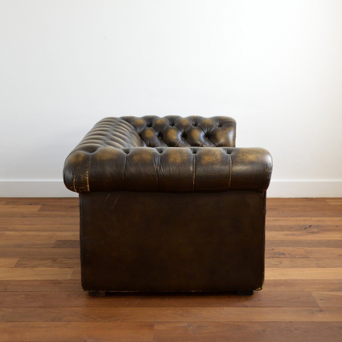 Vintage two-seater leather Chesterfield sofa