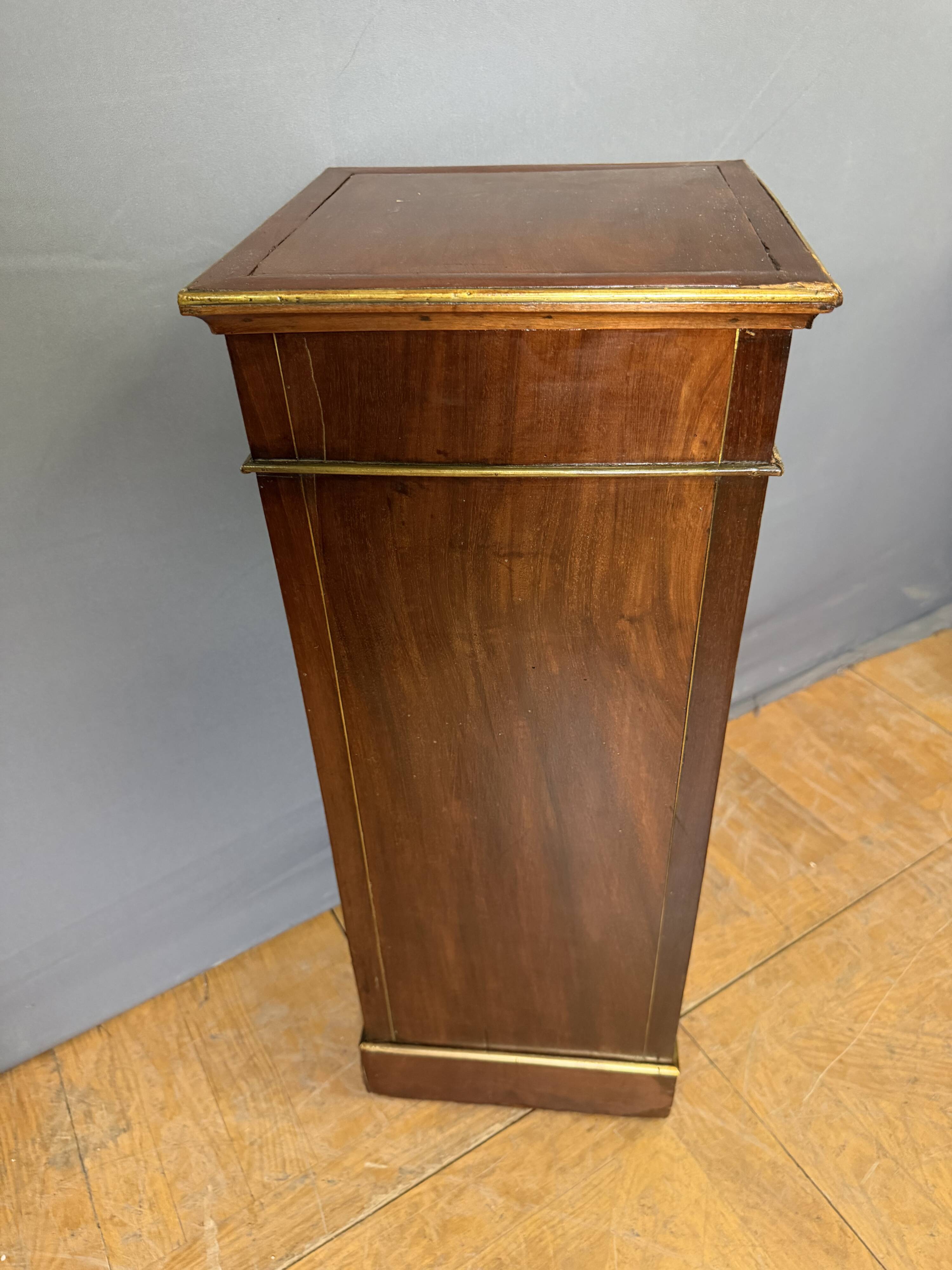 Directoire bedside table in mahogany and brass