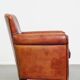 Armchair made of sheepskin leather in a red/brown color