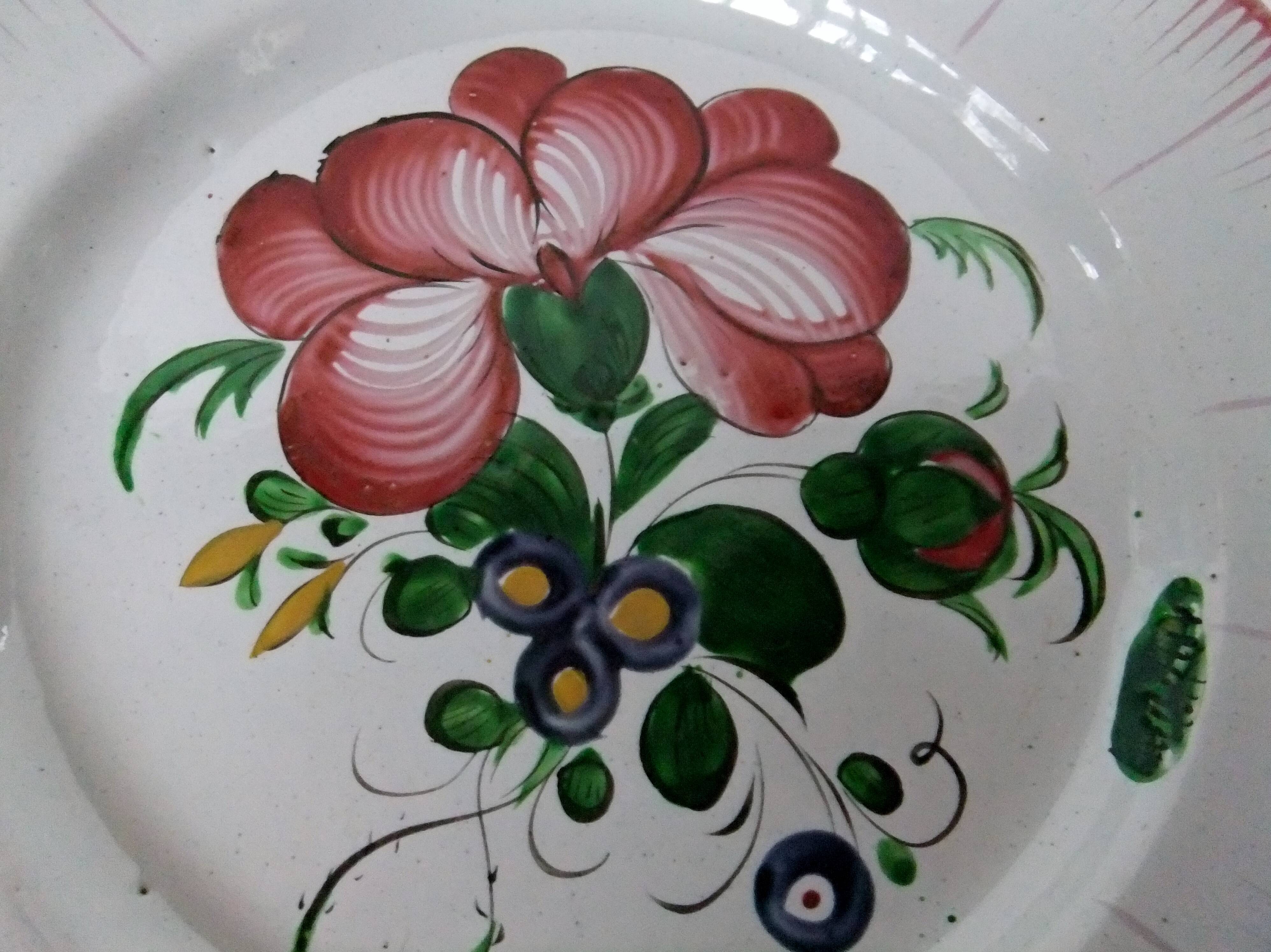 Old earthenware plate of the East Strasbourg decorated with flowers