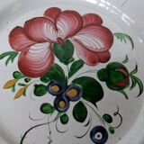 Old earthenware plate of the East Strasbourg decorated with flowers