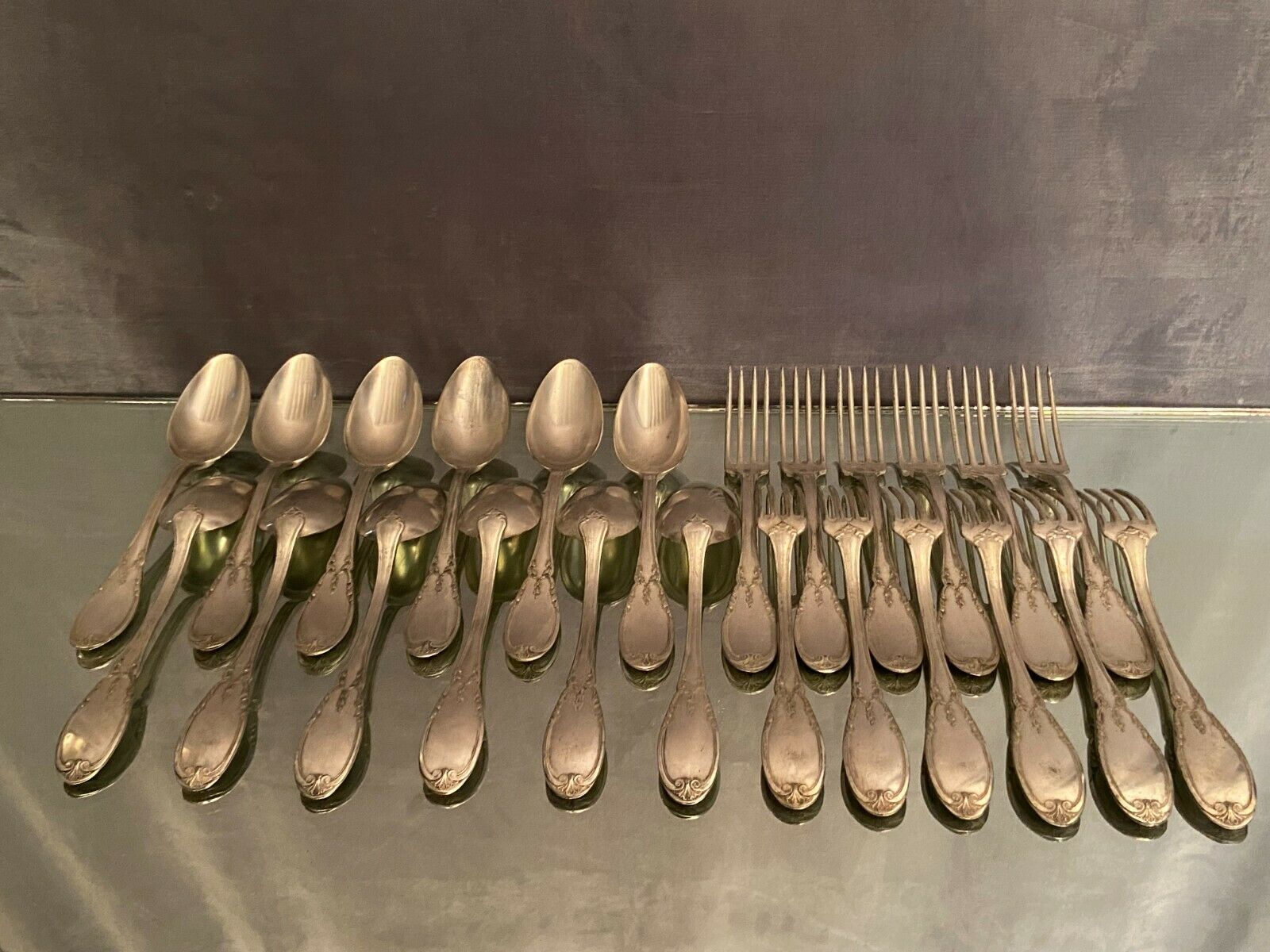 12 forks and 12 spoons in Louis XVI style metal