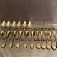 12 forks and 12 spoons in Louis XVI style metal