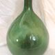 Demijohn with a beautiful glass mixing green and brown