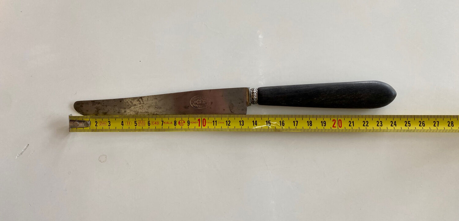 Antique table knives in ebony and steel blade