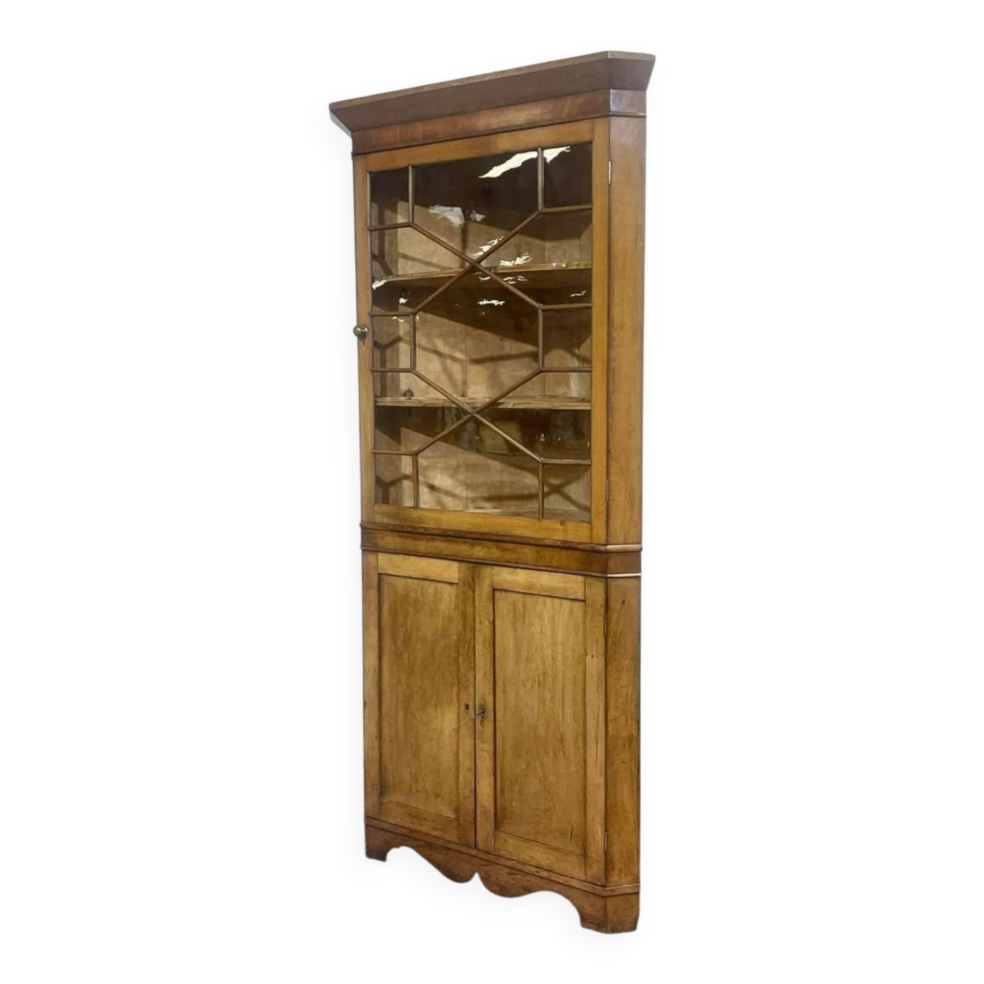 19th-century English corner cabinet in oak, mahogany, and fir.