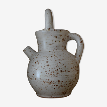 Pitcher in speckled sandstone with double handle