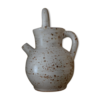 Pitcher in speckled sandstone with double handle