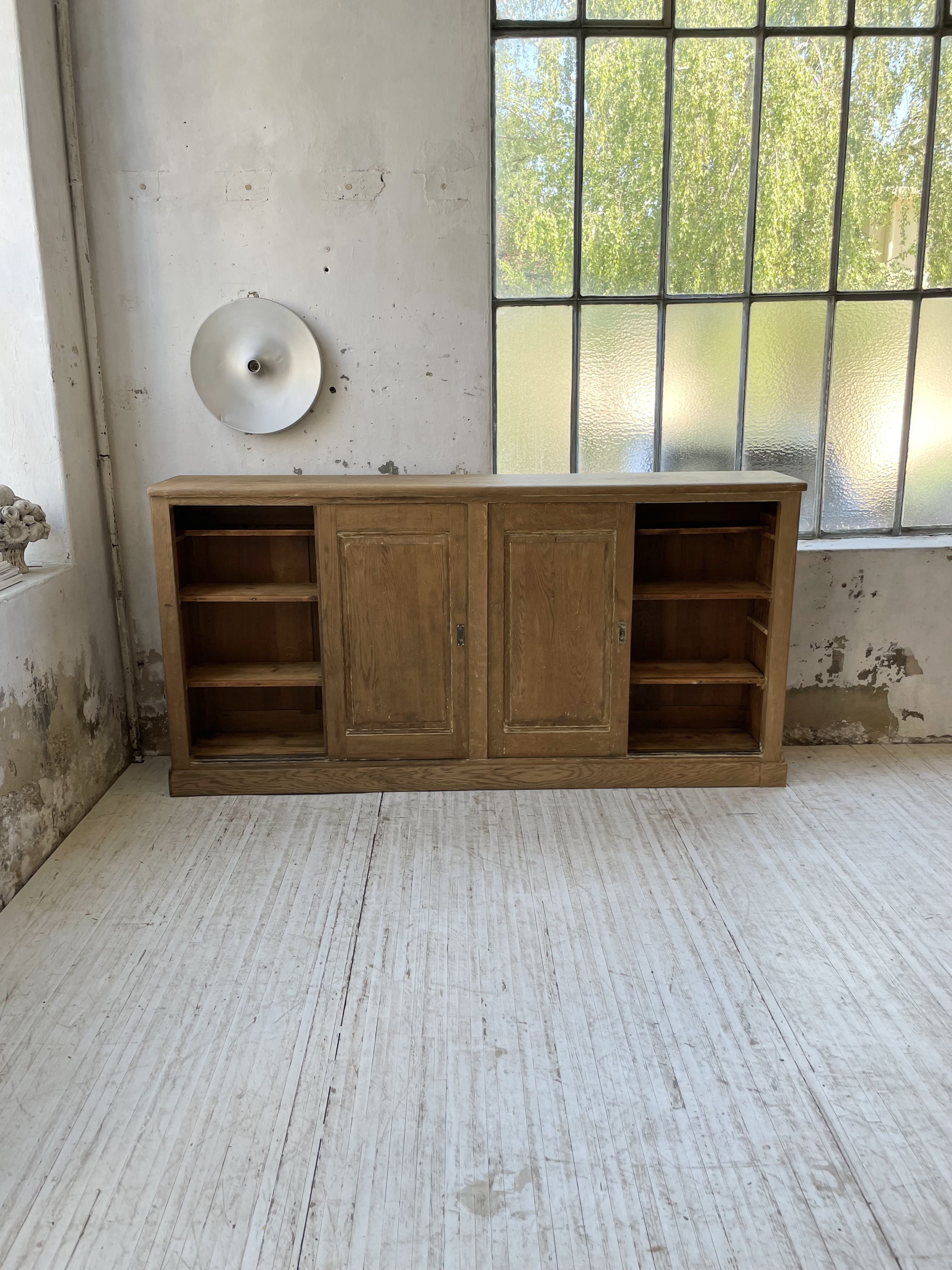 Large row of solid oak loom sliding doors