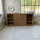 Large row of solid oak loom sliding doors